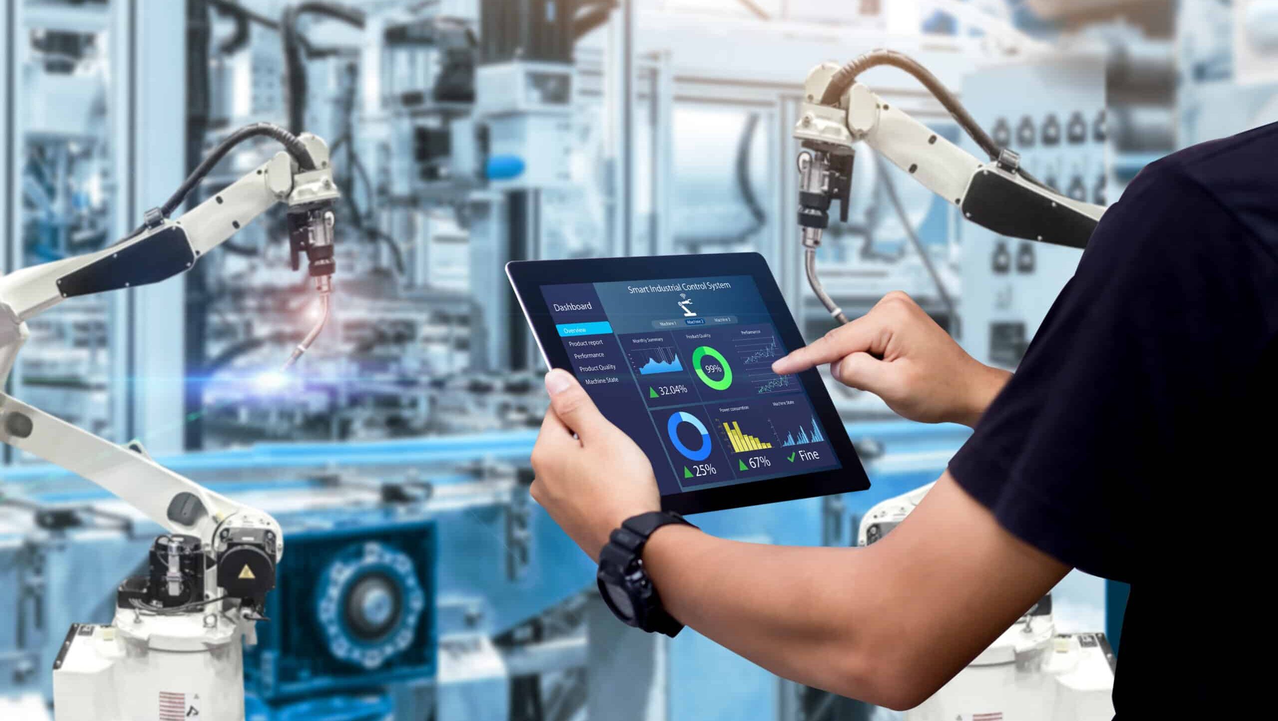 Smart industry control concept.Hands holding tablet on blurred a PDS-200 Precision Dicing Saw